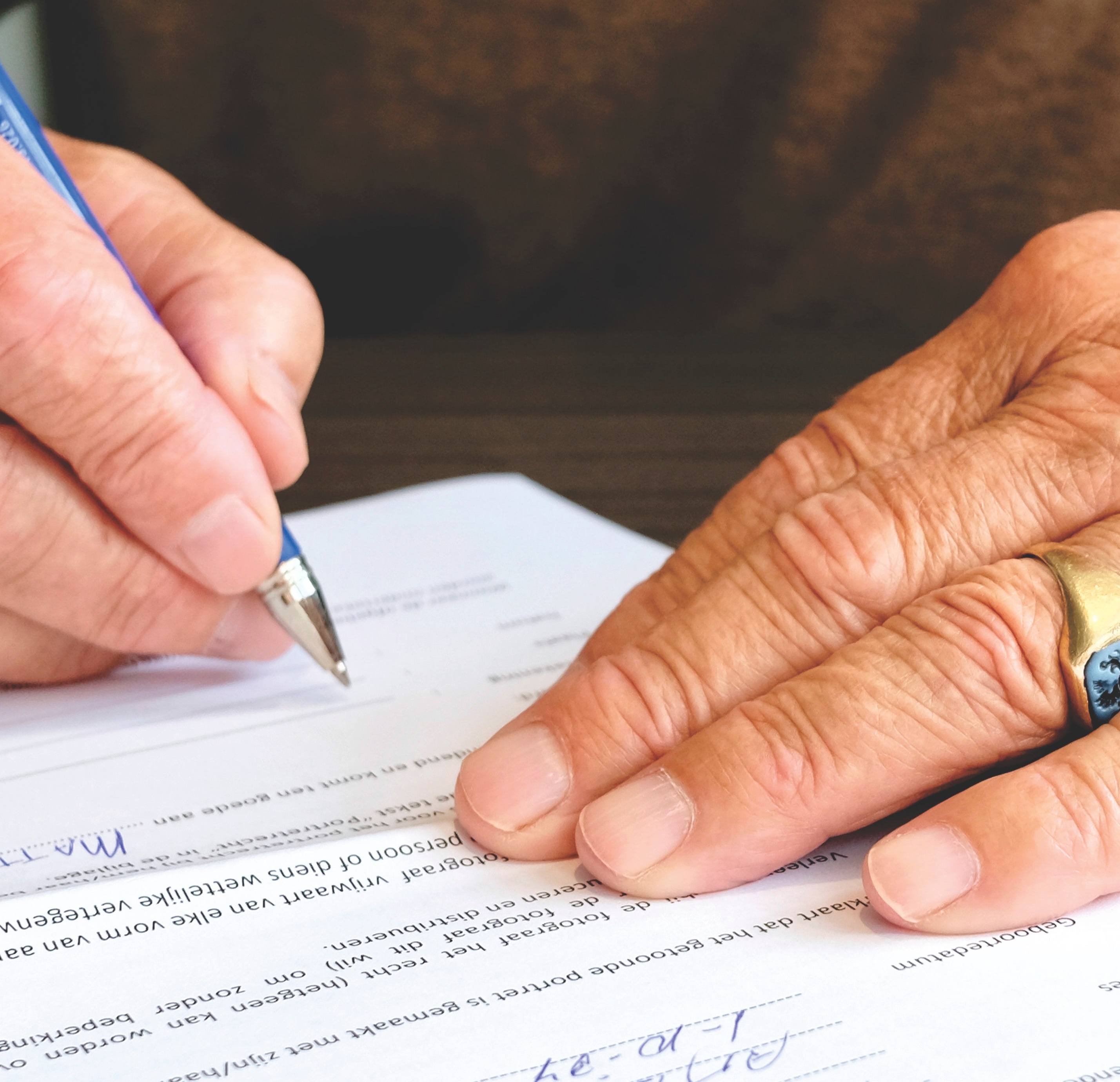 Man signing document